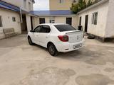 Renault Logan 2016 года за 2 900 000 тг. в Атырау – фото 3