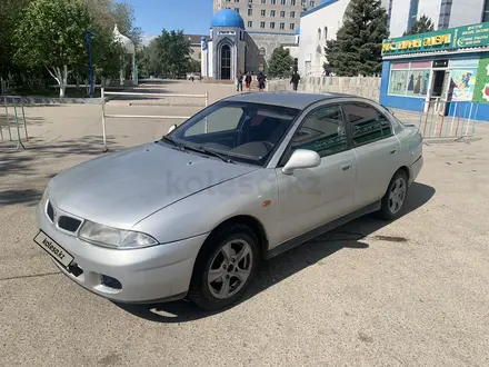 Mitsubishi Carisma 1997 годаүшін1 300 000 тг. в Актобе