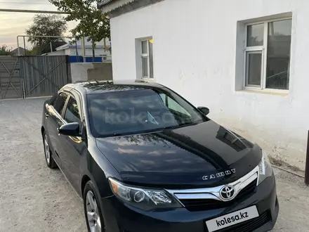 Toyota Camry 2013 года за 8 200 000 тг. в Жанаозен