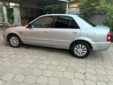 Mazda 323 2000 года за 2 000 000 тг. в Алматы – фото 4