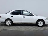 Mazda Familia 1997 года за 850 000 тг. в Астана – фото 4