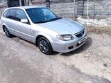 Mazda 323 2001 года за 2 800 000 тг. в Алматы – фото 4