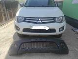 L200 бампер передний 2012г за 50 000 тг. в Алматы