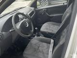 Renault Logan 2014 года за 1 350 000 тг. в Атырау – фото 5