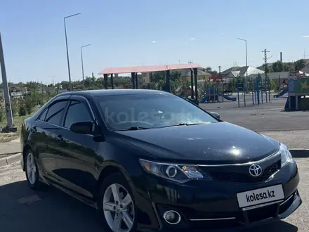 Toyota Camry 2014 года за 9 000 000 тг. в Жезказган