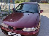 Mitsubishi Carisma 1997 годаүшін750 000 тг. в Жаркент