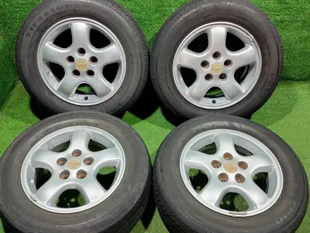 Диск оригинал родной на Nissan с шинами 205/65 R15 за 110 000 тг. в Алматы