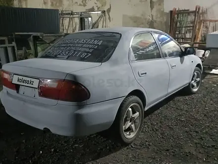 Mazda Familia 1996 года за 500 000 тг. в Астана – фото 7