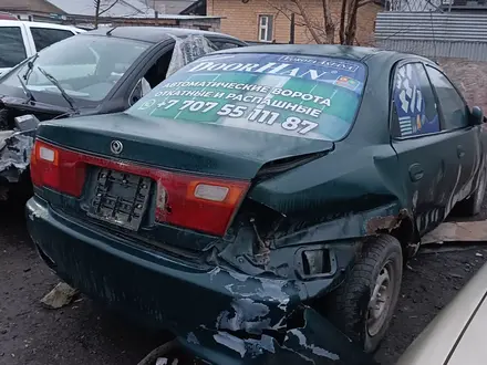 Mazda Familia 1996 года за 500 000 тг. в Астана – фото 12