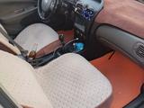 Nissan Almera 2012 года за 3 000 000 тг. в Актау – фото 5