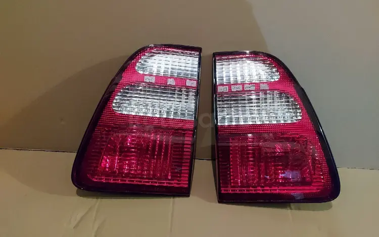 Оригинальные новые задние фонари в крышку Toyota Land Cruiser 100 за 20 000 тг. в Алматы