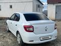 Renault Logan 2018 года за 2 500 000 тг. в Атырау – фото 3