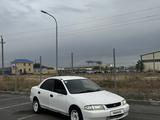 Mazda Familia 1997 года за 990 000 тг. в Астана – фото 2