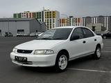 Mazda Familia 1997 года за 990 000 тг. в Астана – фото 4