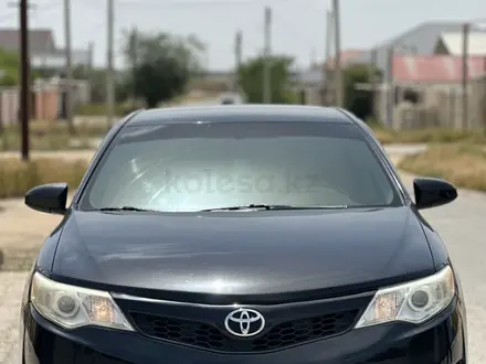 Toyota Camry 2013 года за 7 800 000 тг. в Жанаозен