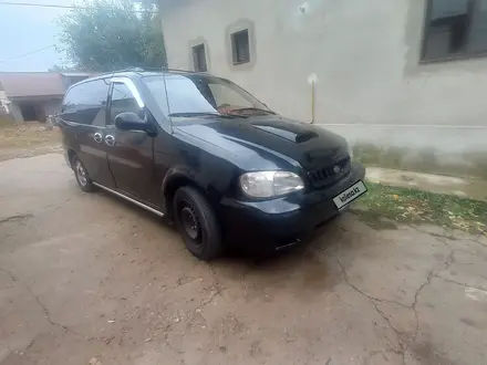 Kia Carnival 1999 года за 1 750 000 тг. в Ленгер