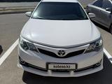 Toyota Camry 2014 года за 6 600 000 тг. в Атырау