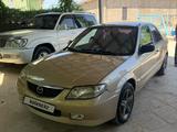 Mazda 323 2001 года за 2 000 000 тг. в Жанаозен – фото 2