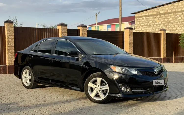 Toyota Camry 2014 года за 6 600 000 тг. в Атырау