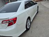 Toyota Camry 2014 года за 8 700 000 тг. в Жанаозен – фото 2