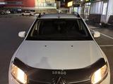 Renault Logan 2014 года за 2 950 000 тг. в Караганда – фото 3