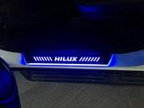 Накладки на пороги с подсветкой Hilux 2015-2022 за 52 000 тг. в Астана