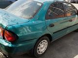 Mazda 323 1997 года за 400 000 тг. в Алматы – фото 2