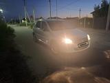 Renault Logan 2012 года за 1 700 000 тг. в Атырау – фото 2