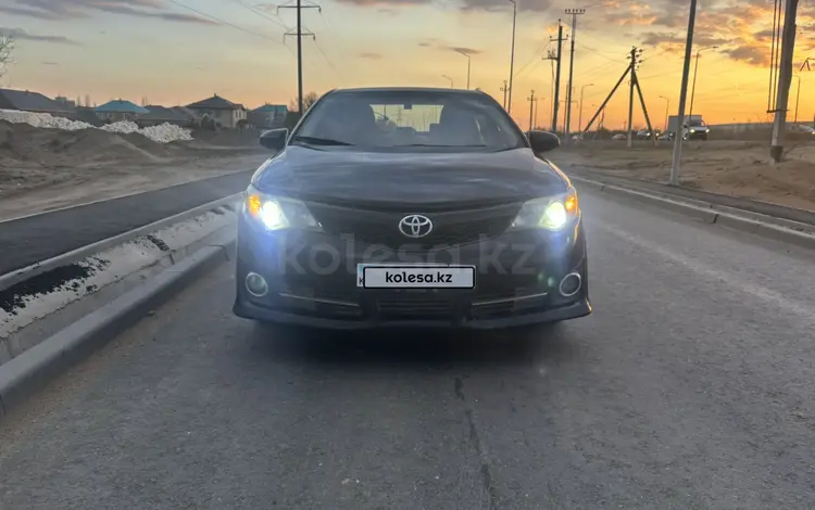 Toyota Camry 2013 года за 6 990 000 тг. в Актобе
