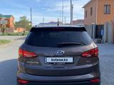 Hyundai Santa Fe 2014 года за 9 200 000 тг. в Атырау – фото 3