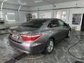 Toyota Camry 2015 года за 11 000 000 тг. в Актобе – фото 2