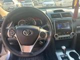 Toyota Camry 2014 года за 8 900 000 тг. в Актобе