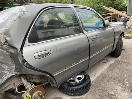 Дверь задняя правая Mazda cronos за 15 000 тг. в Астана