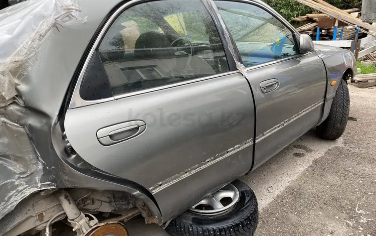 Дверь задняя правая Mazda cronos за 15 000 тг. в Астана