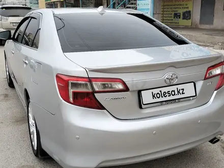 Toyota Camry 2014 года за 7 500 000 тг. в Жанаозен – фото 4