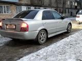 Mazda 323 2003 года за 600 000 тг. в Караганда – фото 4