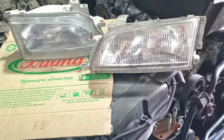 Передние фары на Toyota CarinaE-Caldina б.у оригинальные. за 70 000 тг. в Алматы