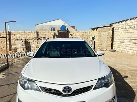 Toyota Camry 2014 года за 6 100 000 тг. в Жанаозен