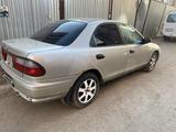 Mazda Familia 1996 года за 950 000 тг. в Астана – фото 4