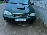 Kia Carnival 1999 года за 1 100 000 тг. в Шымкент