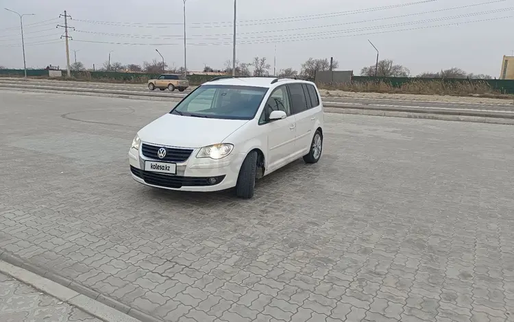 Volkswagen Touran 2009 годаfor3 500 000 тг. в Актау