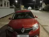 Renault Logan 2014 года за 2 300 000 тг. в Атырау – фото 4