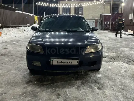 Mazda 323 2001 года за 1 950 000 тг. в Алматы – фото 4