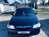 Mazda 323 1999 года за 2 000 000 тг. в Алматы – фото 5