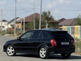 Mazda 323 2002 года за 2 600 000 тг. в Атырау – фото 4