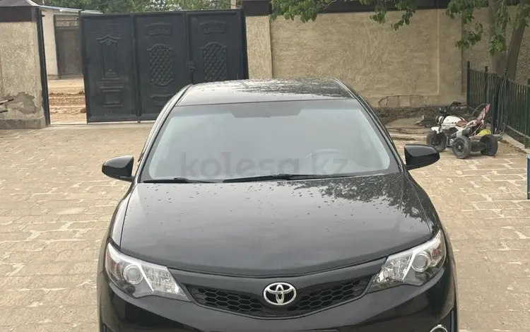 Toyota Camry 2014 года за 4 800 000 тг. в Жанаозен