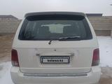 Kia Carnival 2001 годаүшін1 300 000 тг. в Жанатас – фото 2