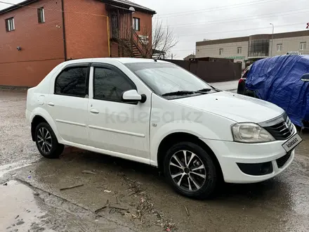 Renault Logan 2013 года за 2 200 000 тг. в Атырау – фото 2