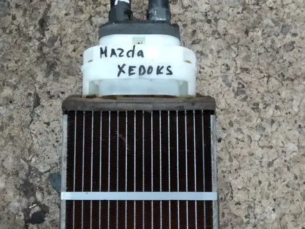 Радиатор печки Мазда кседокс 9 за 15 000 тг. в Караганда