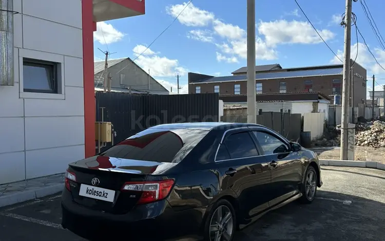 Toyota Camry 2014 годаfor8 250 000 тг. в Атырау